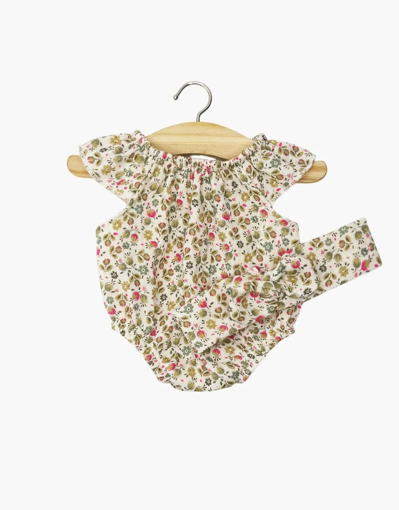 Minikane Doll Clothing | Clara Romper & Headband in Cotton Gauze - Pink Flowers for 13 or 14 inch dolls, hanging on a small wooden hanger.