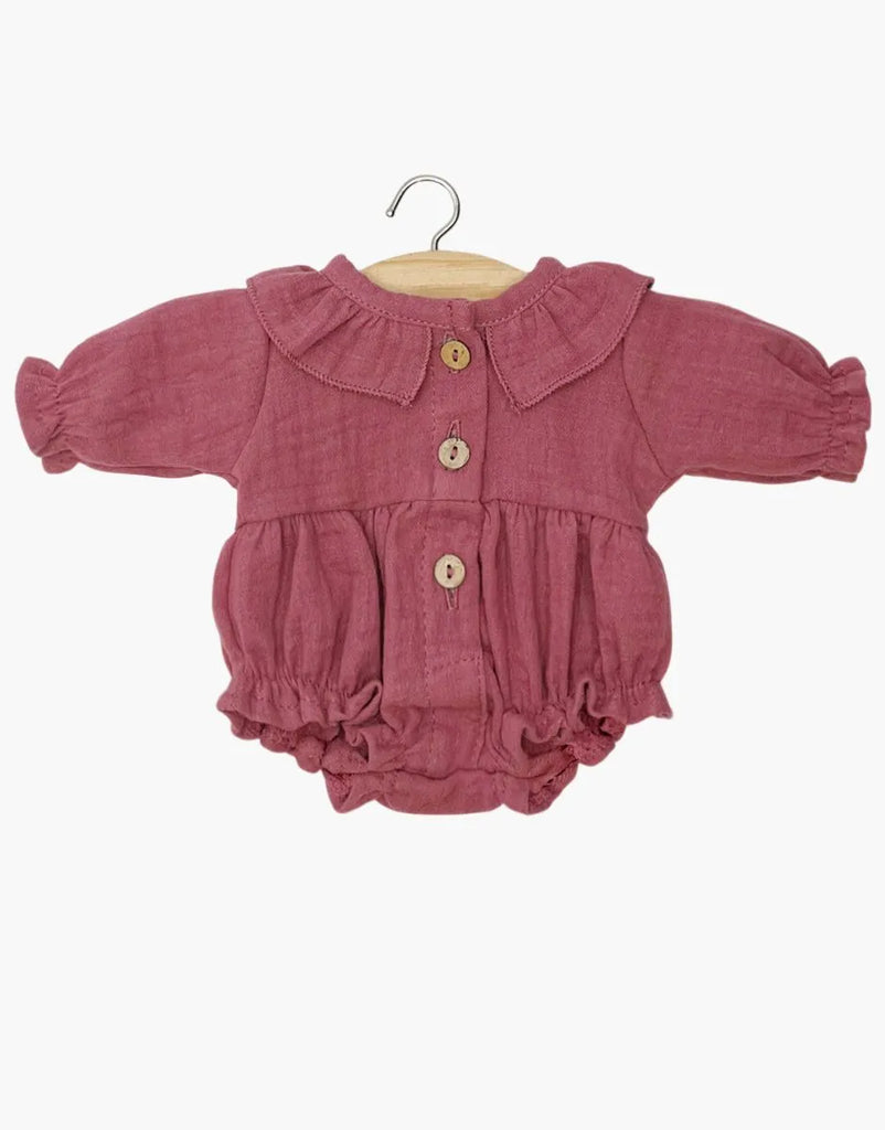Minikane Doll Clothing | Leonore Ruffled Romper in Cotton Gauze - Raspberry for 13″ dolls with a ruffled collar, long sleeves, and three front buttons, hanging on a wooden hanger and made in France.