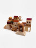 A collection of Sabo Concept Italian Courtyard Blocks shaped like various buildings and architectural elements, arranged together on a white background.