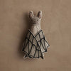 The Coral & Tusk Bat Surprise Doll is a soft plush bat with a stitched face and black-edged fabric wings, ideal as a cute decor piece or Halloween decoration. Ships in one week; shown on a textured beige background.