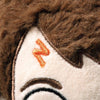 Close-up of a Steiff Harry Potter Plush 11" face featuring brown embroidered hair, an orange embroidered "N" shape on the side of the head, and part of an eyebrow stitched with brown thread.