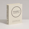 The Scrabble Vintage Bookshelf Edition is a cream-colored, book-shaped box that stands upright and features premium game components. It’s designed for 2–4 players ages 8 and up.