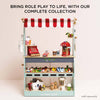 Bring role play to life with our Market Fish Wooden Play Market Crate—complete with a colorful market stand, red-and-white striped canopy, toy cash register, fruits, vegetables, coffee machine, fresh fish crate, and grocery items.