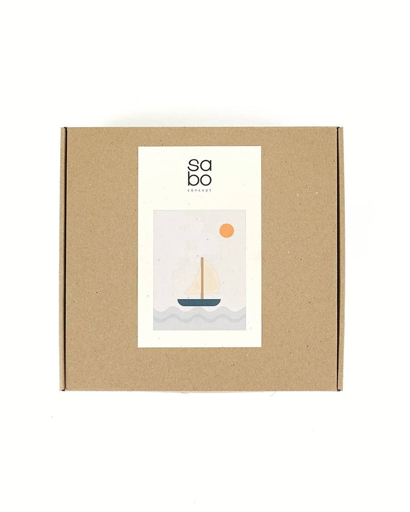 A brown cardboard box with a white label featuring minimalist sailboat art and “sabo concept” text—perfect for gifting the Sabo Concept Sea Adventure Set.
