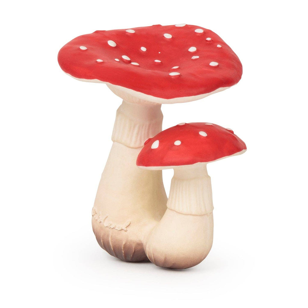 Spot the Mushroom Teething Toy is a natural rubber baby toy shaped like two red-and-white spotted mushrooms with thick beige stems, placed side by side—perfect for teething and sensory play.