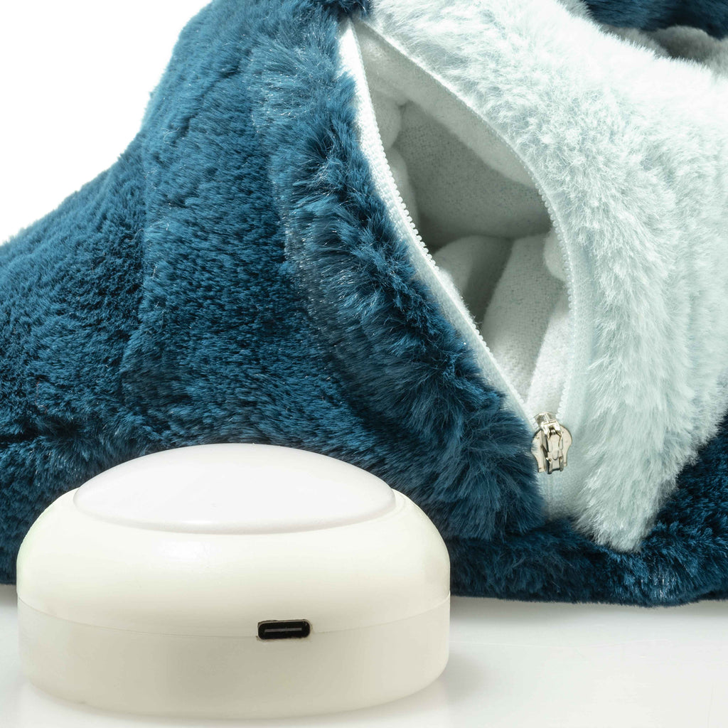 A cuddly Steiff Light at Night Spott Stegosaurus stuffed plush, 11 inches, sits ready for snuggles. Its soft blue fabric and white details make it perfect for cozy nights with a touch of prehistoric charm.
