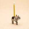 The Elephant Cake Topper - Final Sale (ships in one week) features a hand-painted elephant in a party hat and cloak, holding a yellow candle—an adorable collectible keepsake.