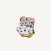 The Sticky Lemon Backpack Large | Color Blocking | Coral Pink + Reed Green features a white interior lining with playful black animal, umbrella, and soccer ball illustrations—crafted from recycled PET bottles for a sustainable, colorful kids' backpack.