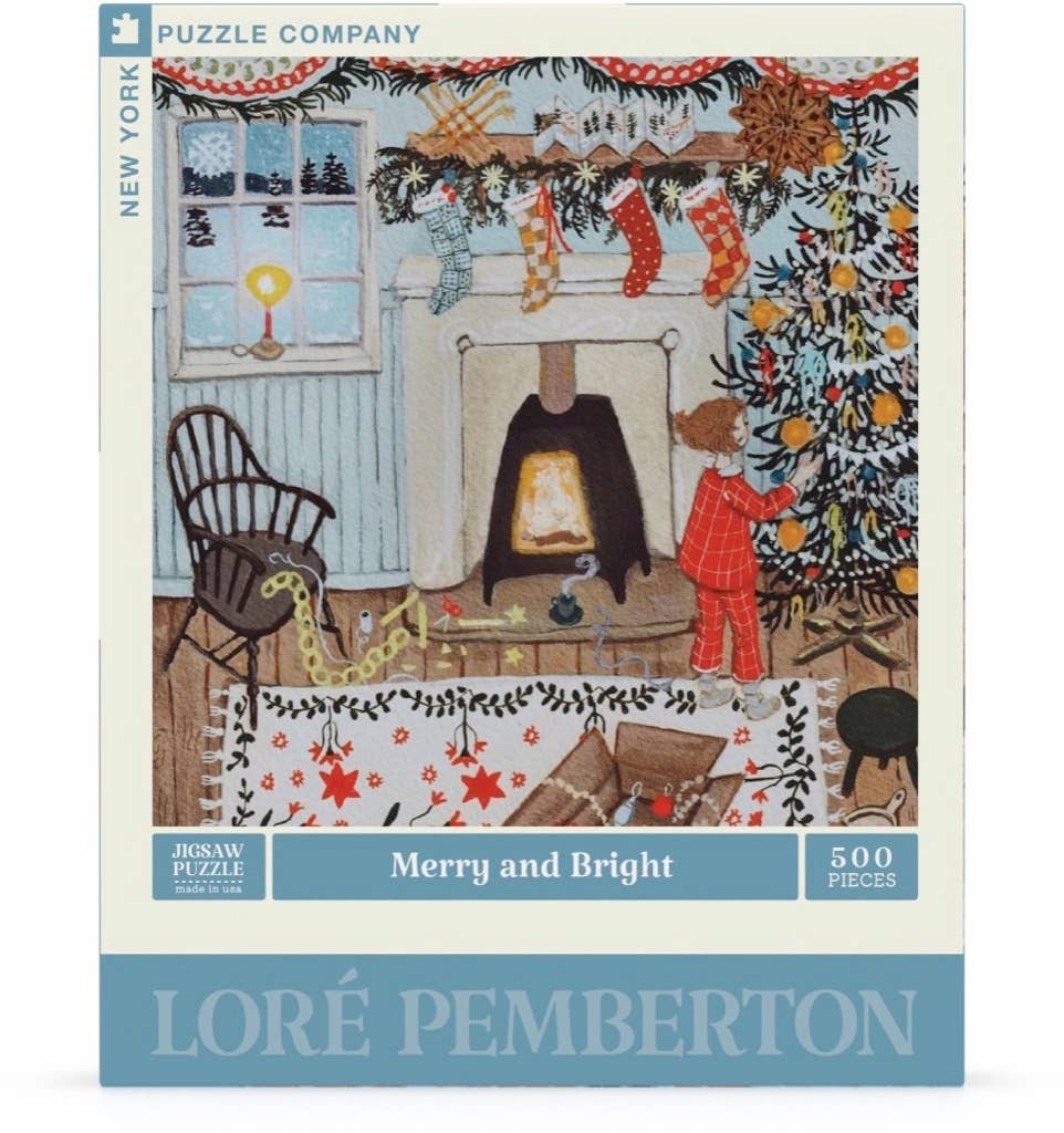 The Merry and Bright - 500 Piece Jigsaw Puzzle box features an illustration of a child in pajamas decorating a tree near a fireplace with holiday decor and stockings.