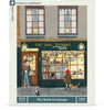 Illustration of The Book Exchange bookshop with a festive cat, a man in blue holding books, and a girl in a red scarf—The Book Exchange - 1000 Piece Jigsaw Puzzle makes a perfect gift for book lovers.