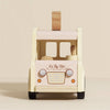 Front view of the Wooden Ice Cream Van, a vintage-style cream and light pink toy with "Le Toy Van" branding, orange headlights, wooden driver, removable roof handle. Ships in one week.