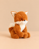 Archie the Fox from the Snuggle Bunnies collection is a fluffy plush with rust-colored fur and a white belly, chest, and tail tip.