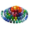 Grimm's Stepped Pyramid Block Set - Small features colorful blocks stacked in concentric circles, forming a vibrant rainbow gradient from the inner to outer rings, inspired by the iconic Grimm's pyramid design.