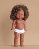 The Minikane Standing Doll (14") - Charlie features brown skin, curly brown hair, and blue eyes, shown upright in white underwear against a plain beige background. Clothing is sold separately. Made in Spain.