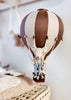 The Hot Air Balloon - Light Brown / Dark Brown features a small stuffed mouse in overalls sitting in a basket, making a charming indoor decoration for children's rooms.