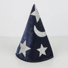The Meri Meri Blue Velvet Wizard Costume - Final Sale features a cone-shaped velvet hat in dark blue, adorned with silver glitter stars and a crescent moon, standing upright on a plain light surface. Perfect for magical dress-up!.