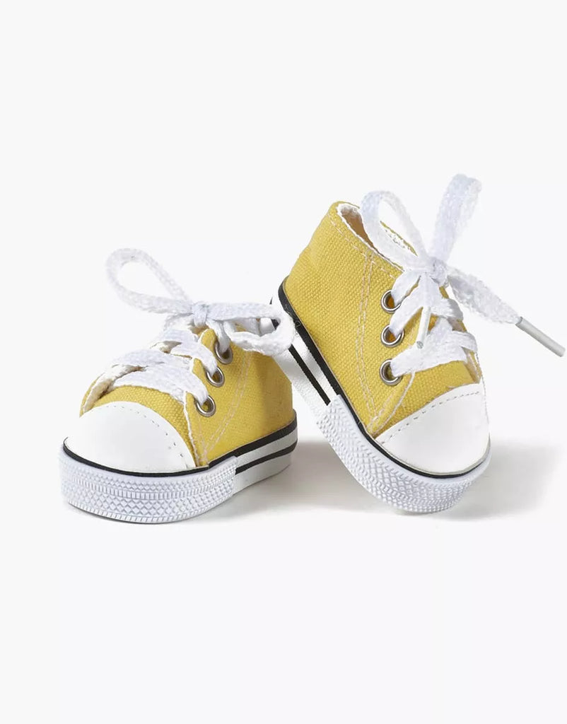 Minikane Doll Shoes | Converse Style Lemon Sneakers—small yellow canvas sneakers with white toes, laces, and black sole stripes—are perfect accessories for Minikane Gordis 34cm dolls or as doll shoes.