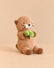 Snuggle Bunnies - Ollie the Otter - Cocoa is a brown plush otter sitting and holding a small green plush turtle.