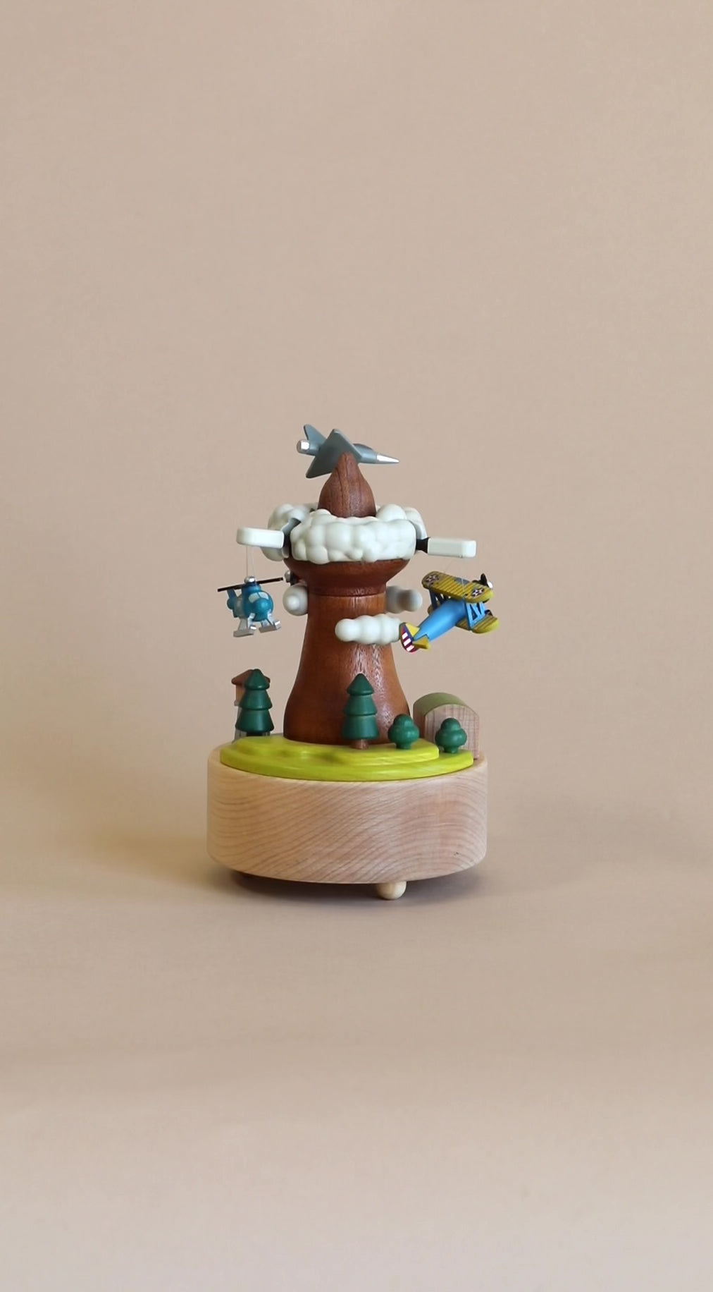 Wooden music box with airplanes going around