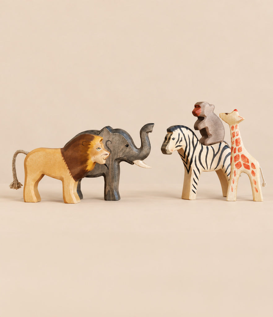 Handmade Holzwald Safari Animals Set featuring wooden lion, elephant, zebra, monkey, and giraffe figurines.