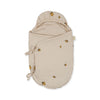 The Konges Sloejd Doll Sleeping Bag - Lemon is a beige swaddle with a hood, made from organic cotton and decorated with a small lemon print. It features two side ties to secure the wrap.