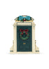 A Konges Sloejd Christmas Door in dark green, featuring a festive holiday wreath with a red bow and a blue decorative bow on top.