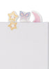 An A5 Konges Sloejd My Stationery Box - Unicorn notebook with transparent adhesive bookmarks in the shapes of a star, butterfly, and crescent moon attached to the top edge.