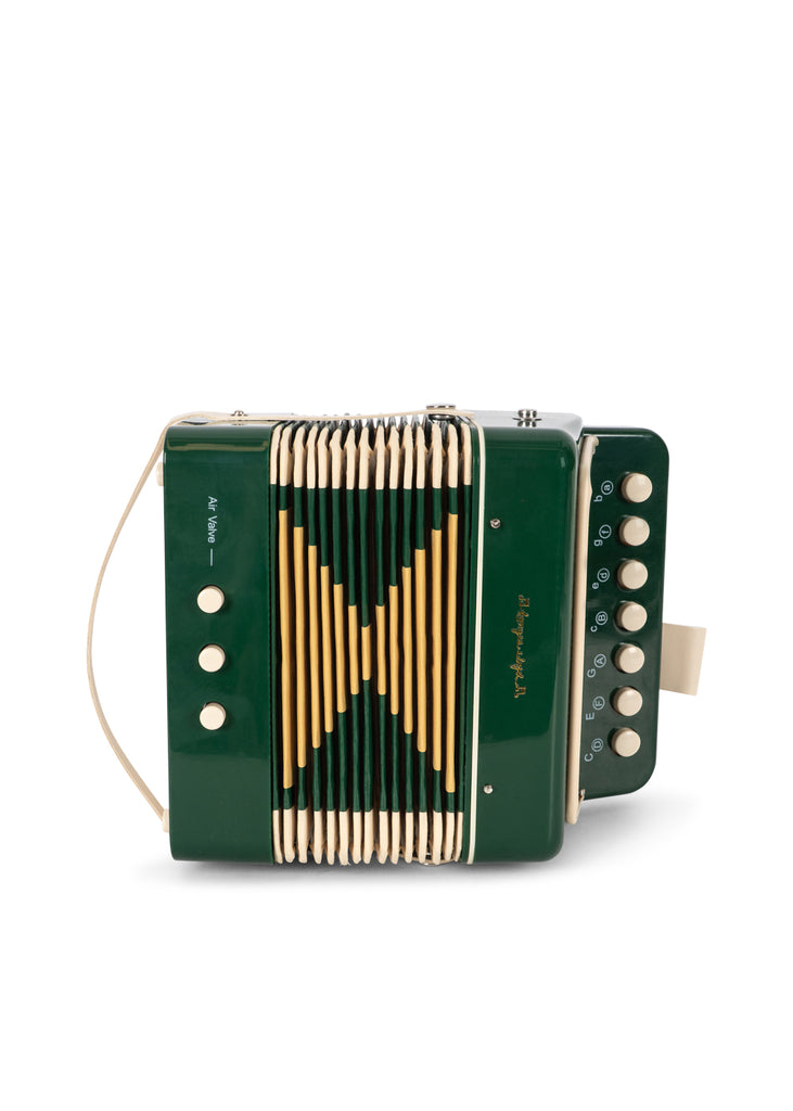 Konges Sloejd Accordian in dark green with yellow bellows, cream-colored buttons, and labels for the air valve and musical notes.
