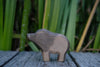 A small, hand-carved wooden toy of a wild boar, the Handmade Holzwald Wild Boar.