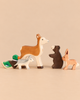 Holztiger Handmade Wooden Woodland Animals Set featuring five handcrafted wooden toys: a duck, a wolf, a deer, a bear, and a rabbit for imaginative play.