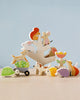 A collection of Stacking Garden Friends, including a cat, dog, turtle, and parrot, imaginatively stacked against a soft blue background.